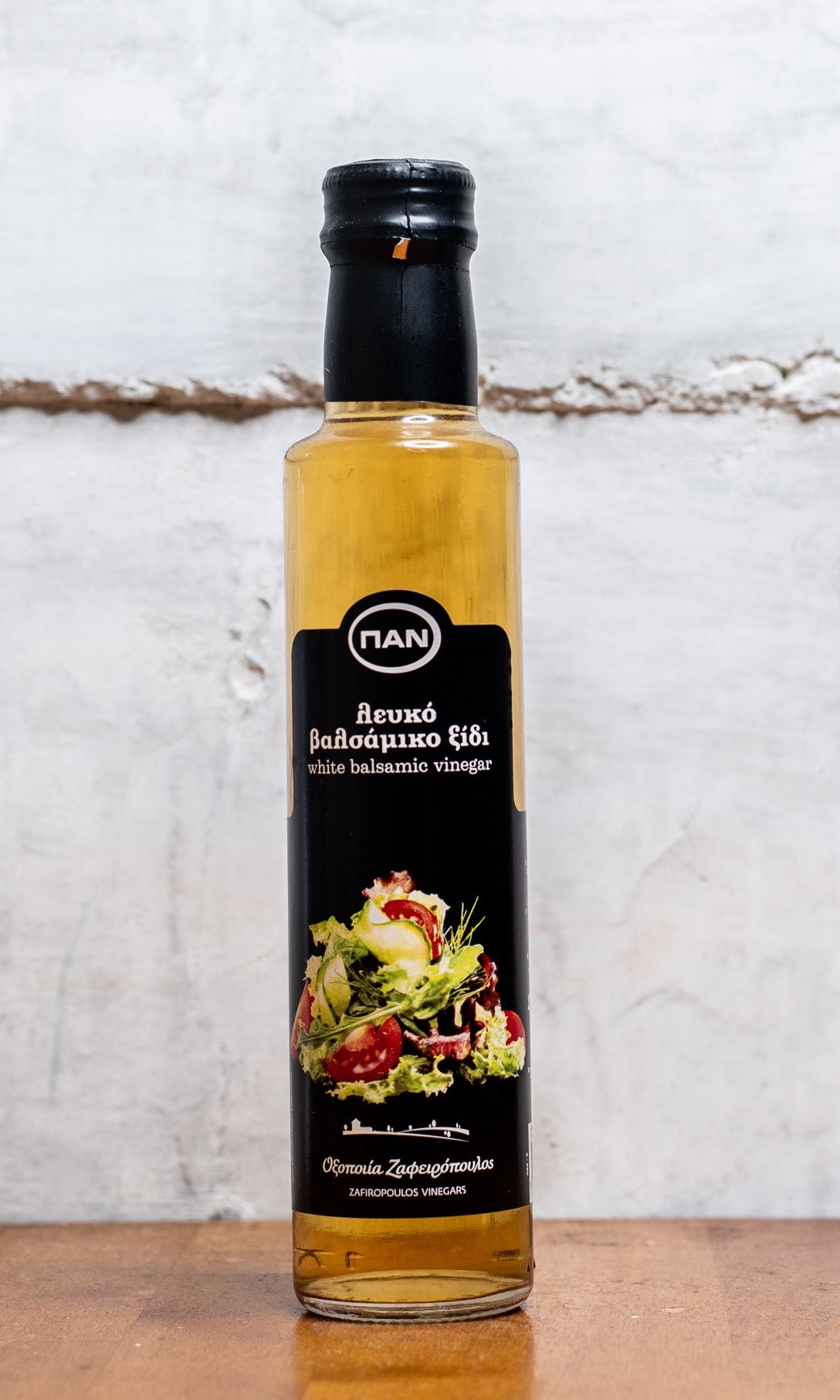 PAN White Balsamic Vinegar meets concentrated Greek grapemust in this thick, bright-golden cream. The bouquet includes fresh grapes and balsamic vinegar, while, on the palate, the densely sweet taste of must pleasantly undermines the acidity of vinegar. Use it to add the flavor and aromas of balsamic vinegar in recipes where a darker color is not desirable, such as salad dressings and white sauces for fish or chicken. Pour over fruit salads and ice cream for a delicious treat.